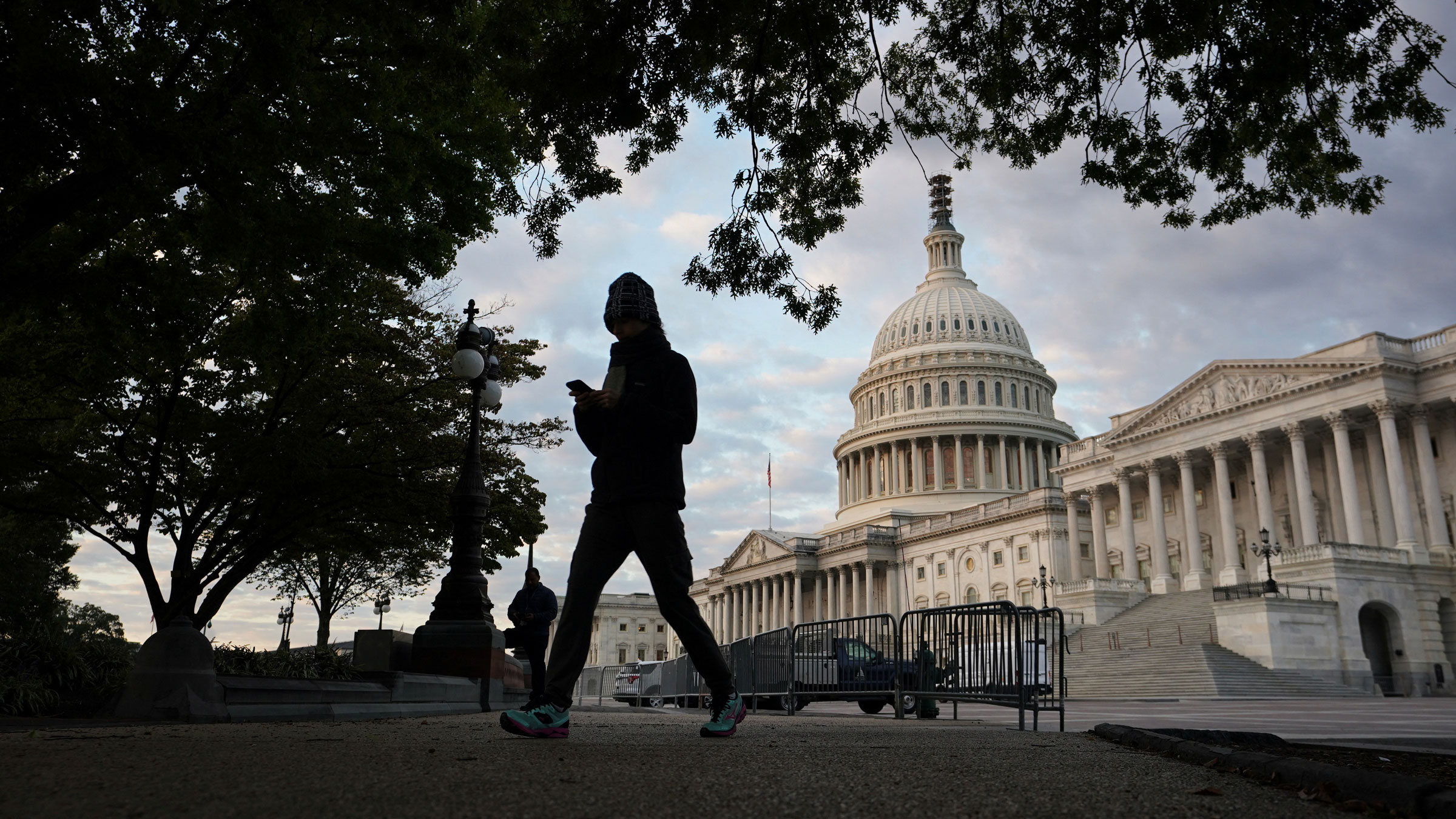 A woman walks past the US Capitol on Tuesday.